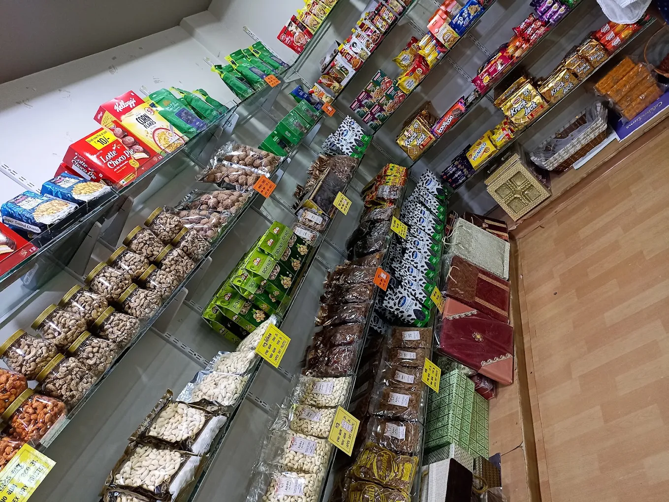 Shelves of cashew jars, almond packs, dates and gift boxes